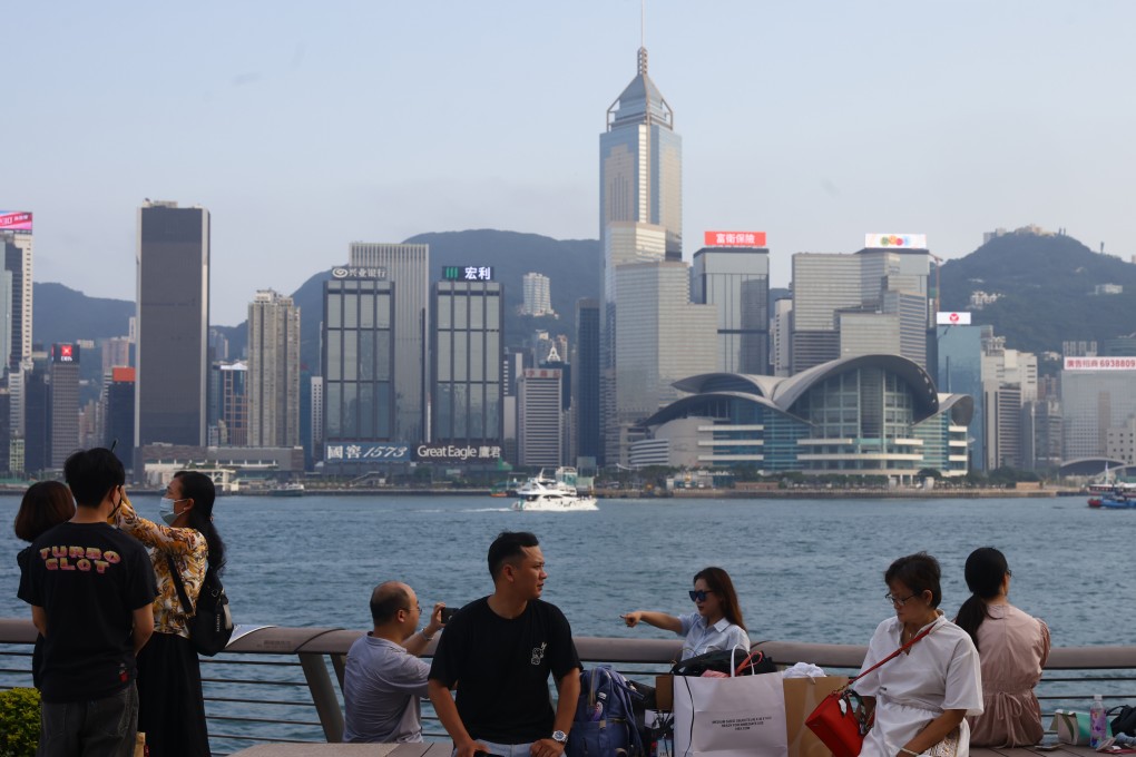 Tourists visit the waterfront in Tsim Sha Tsui.    10JUN23  SCMP /Dickson Lee