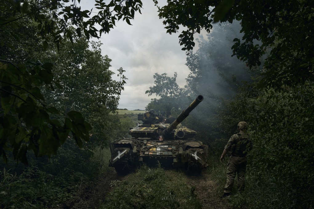 A Ukrainian tank rides along the road towards position near Bakhmut on Saturday. Photo: AP