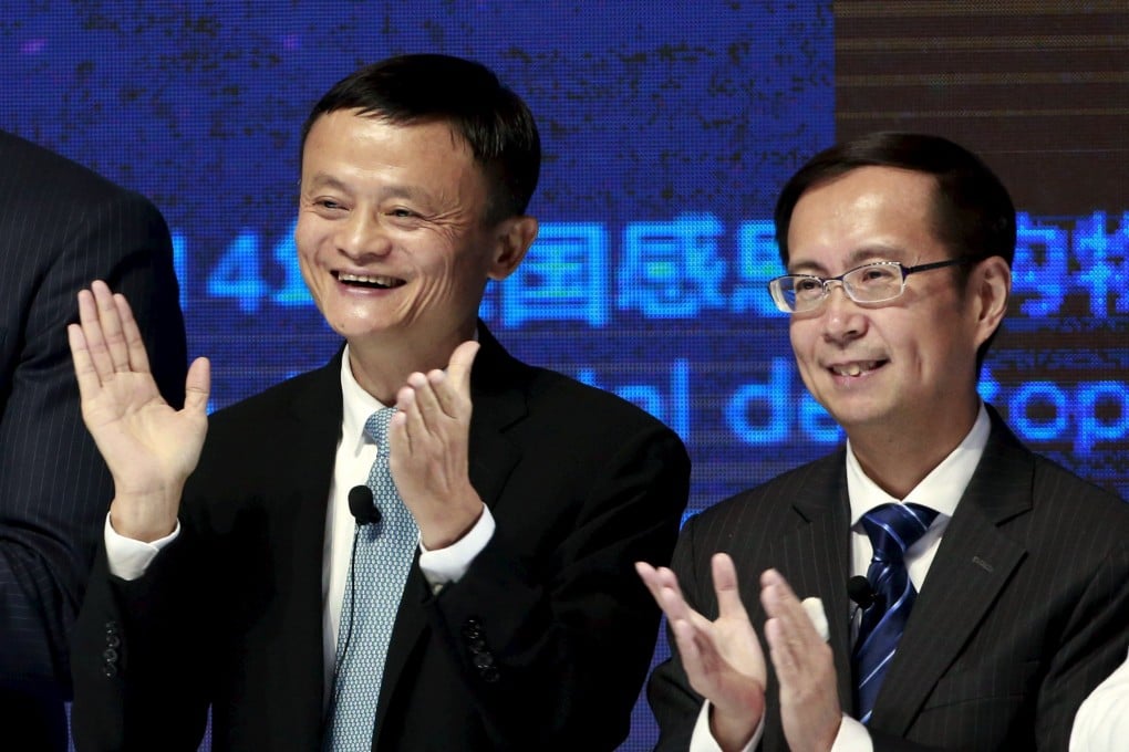 Alibaba founder and chairman Jack Ma (left) and CEO Daniel Zhang clap at the New York Stock Exchange Bell Ringing ceremony during Alibaba Group’s 11.11 Global Shopping Festival in Beijing on November 11, 2015. Photo: Reuters