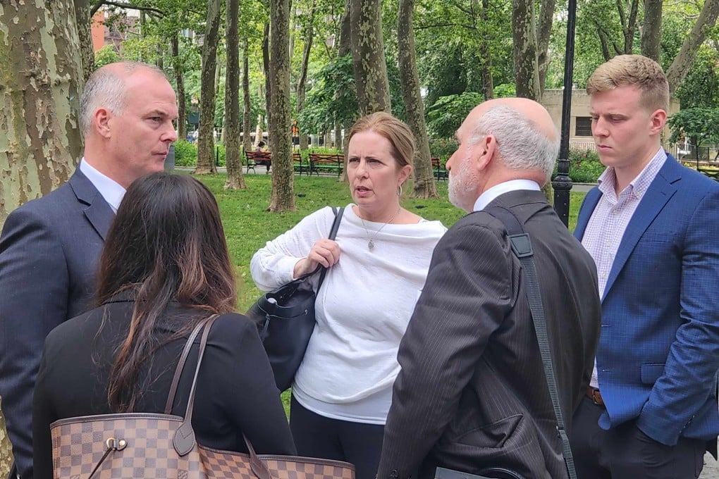 Michael McMahon (left) with his wife, son and lawyers after the verdict was delivered in New York on Tuesday. Photo: Mark Magnier