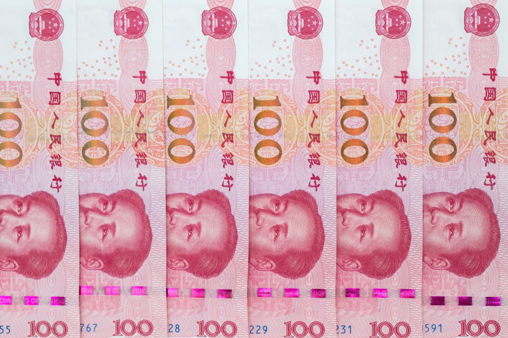 Chinese one-hundred yuan banknotes are arranged for a photograph. Photo: Bloomberg