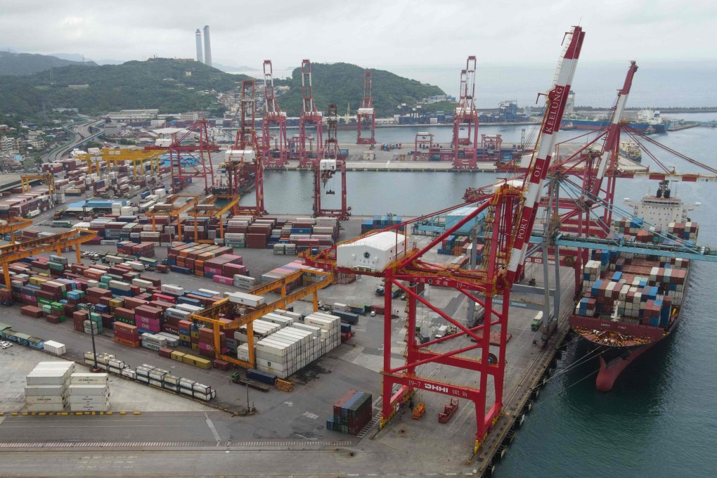 Containers are moved onto a cargo ship at the Port of Keelung in Taiwan. Photo: AFP