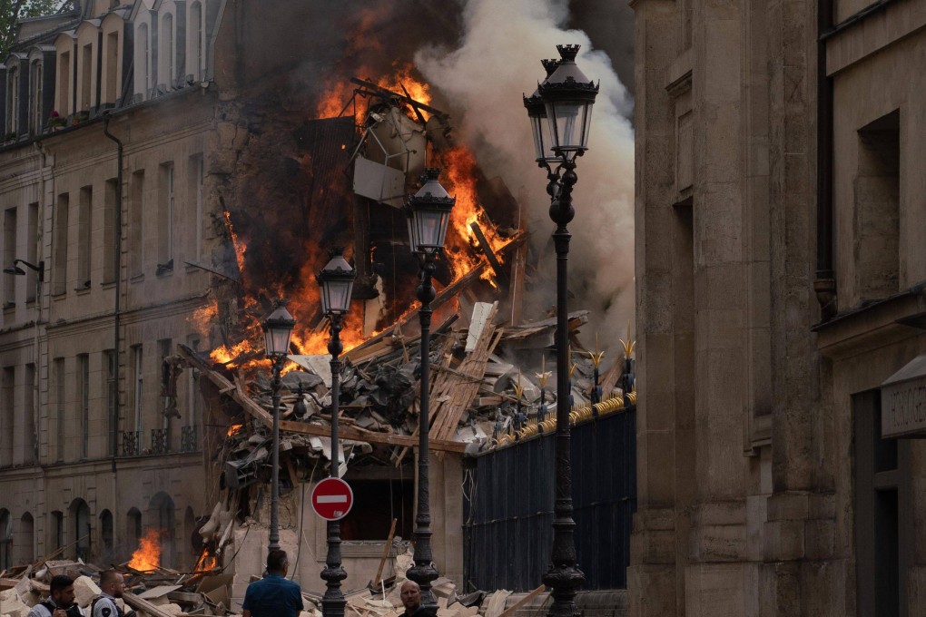 The strong explosion rocked a building in Paris, igniting a fire that sent smoke soaring over the French capital’s monuments. Photo: AFP