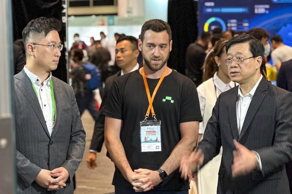 Hong Kong Chief Executive John Lee Ka-chiu, far right, is seen in a discussion with Verobotics co-founder and chief executive Ido Genosar, centre, on June 18, 2023, at the conclusion of the two-day Hong Kong Science Fair at the Hong Kong Convention and Exhibition Centre in Wan Chai. Photo: Handout