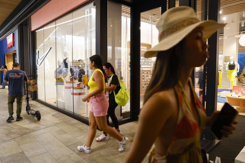 Shoppers outside a Nike store at Brickell City Centre in Miami, Florida, US, on June 14, 2023. US retail sales unexpectedly rose in May, showcasing resilient consumer demand in the face of mounting economic challenges. Photo: Bloomberg