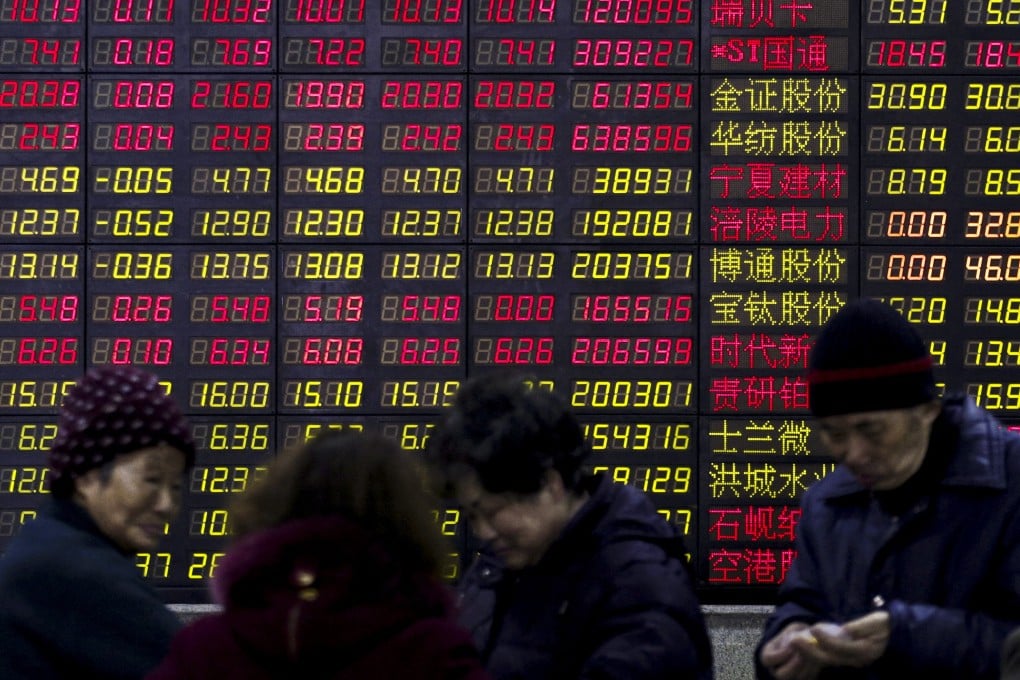 Investors stand in front of an electronic board showing stock information at a brokerage house in Shanghai, China. Photo: Reuters