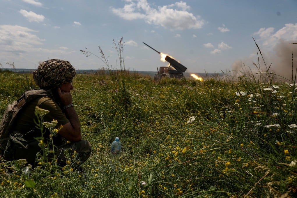 Soldiers fighting for Ukraine fire a rocket towards Russian positions near the front line in the Zaporizhzhia region on Sunday. A handful of Japanese men have defied their government’s warnings and joined Ukrainians battling the Russian invasion. Photo: Radio Free Europe/Radio Liberty via Reuters