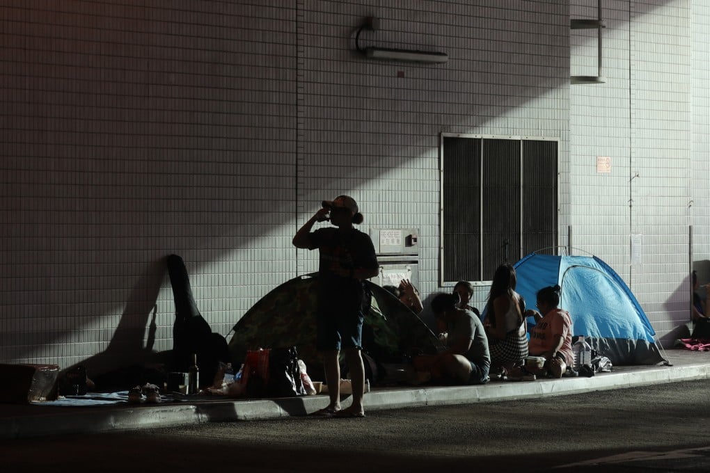 The slanting afternoon sun lights up a bus station in North Point where domestic workers shelter on their day off on June 11. While these workers contribute to the wellness of many Hong Kong families, they are often left out of discussions on mental wellbeing. Photo: Xiaomei Chen