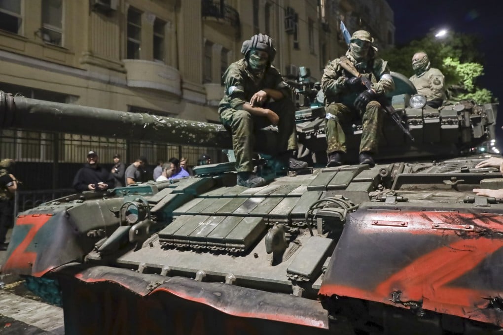 Membes of the Wagner Group military company sit atop of a tank on a street in Rostov-on-Don, Russia on June 24. Photo: AP