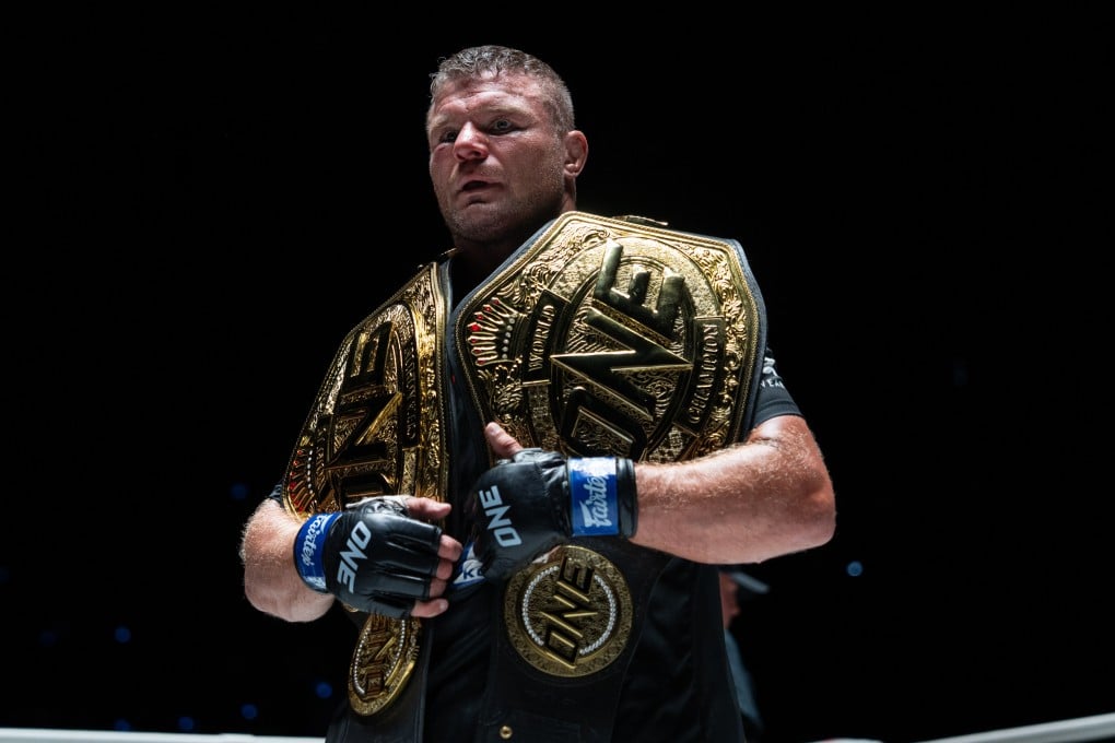 Anatoly Malykhin celebrates with his two titles at ONE Friday Fights 22. Photos: David Picton
