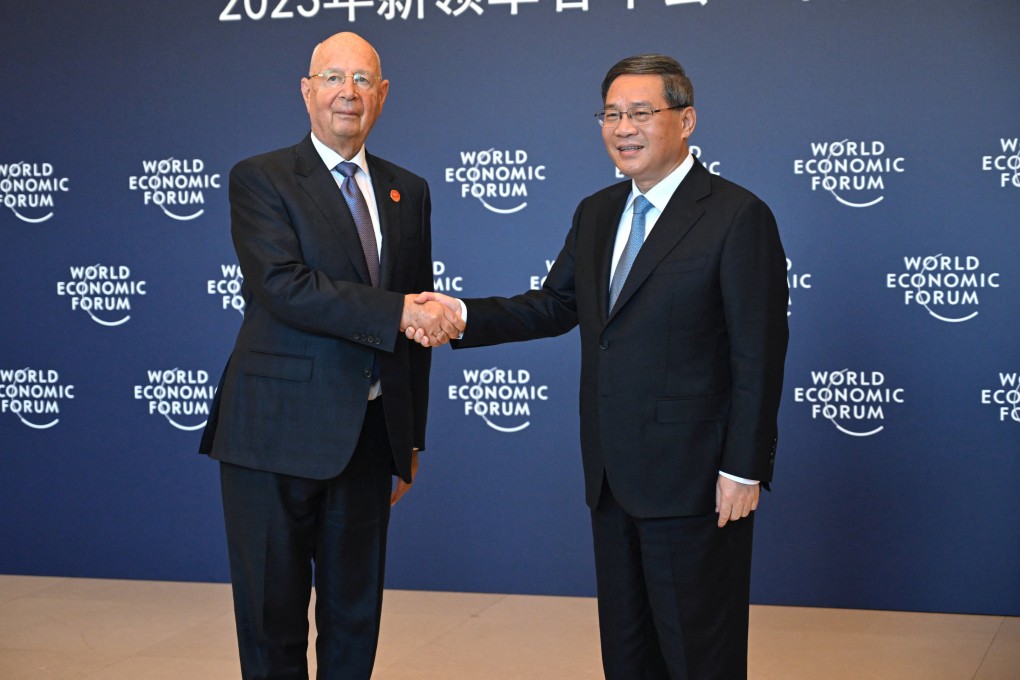 Chinese Premier Li Qiang shakes hands with founder and executive chairman of the World Economic Forum, Klaus Schwab, before their bilateral meeting ahead of the annual World Economic Forum New Champions in Tianjin. Photo: Reuters
