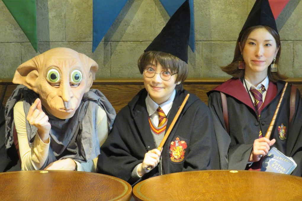 Fans dress up as characters from the Harry Potter films on the first day of opening of The Warner Bros Studio Tour Tokyo, the Making of Harry Potter attraction in Japan, which has everything Harry Potter fans could want. Photo: Tamara Hinson