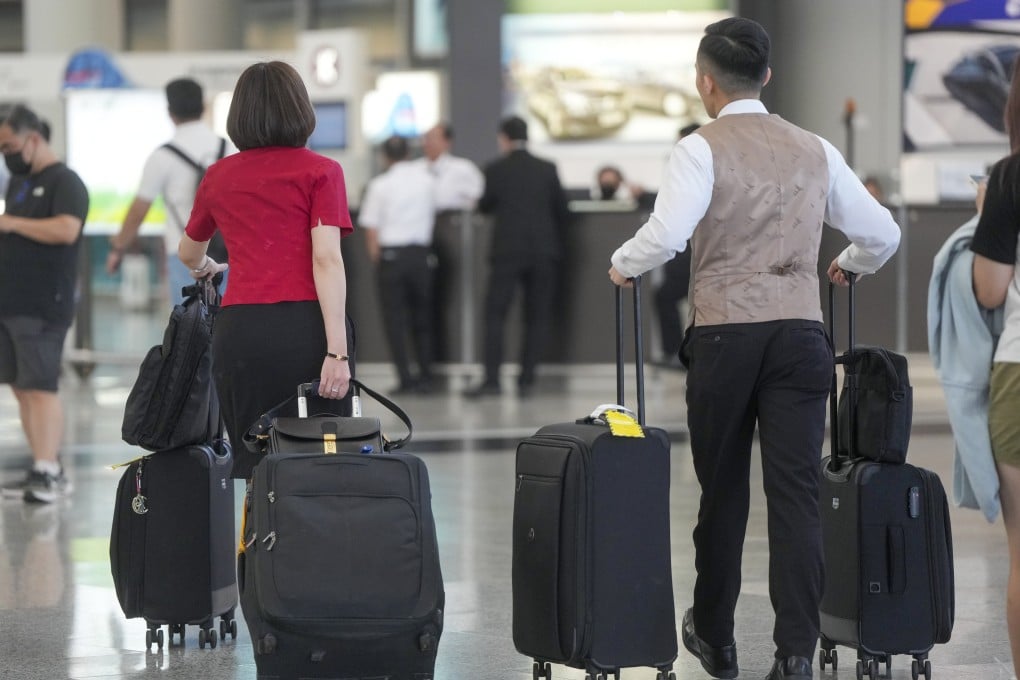 Cathay Pacific flight attendants exit the departure hall of Hong Kong airport on May 28. Photo: Sam Tsang