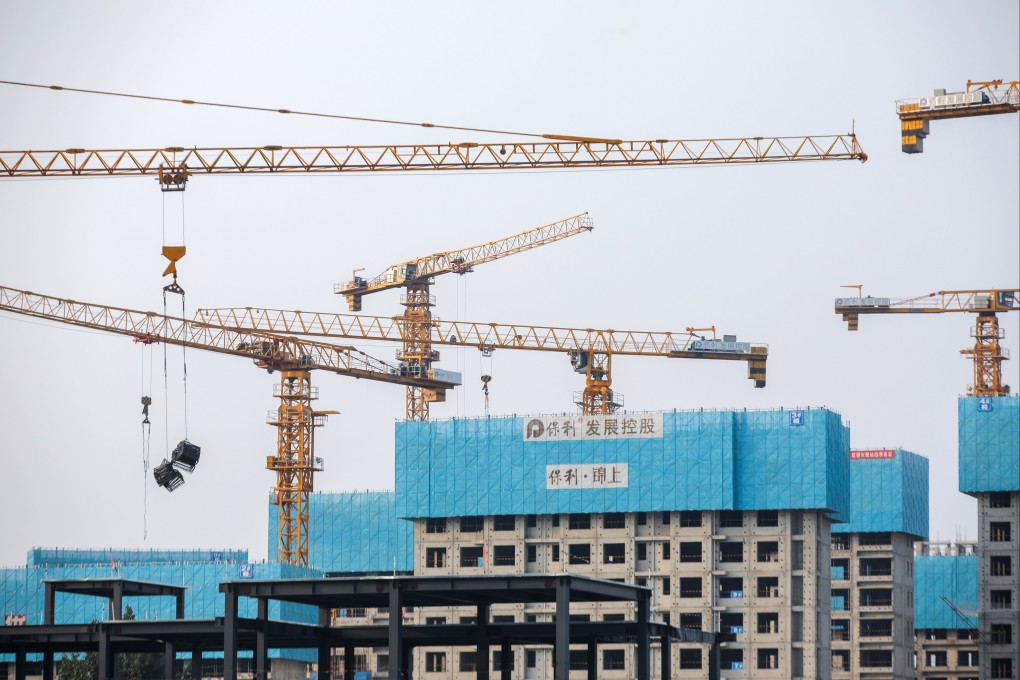 Buildings under construction in Beijing. Currently, 23 A-share developers have revealed share sale plans for raising more than 92.5 billion yuan, but only a few have been given approvals so far, according to Guosheng Securities. Photo: EPA-EFE