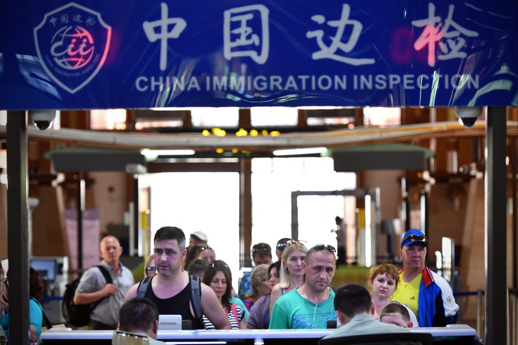Tourists arrive at the airport in Sanya, south China’s Hainan province, in 2018. Photo: Xinhua