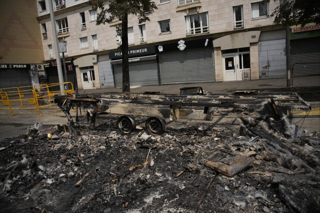 A charred vehicle in Nanterre, outside Paris, after violence erupted over the death of a 17-year-old delivery driver who was shot and killed by police. Photo: AP