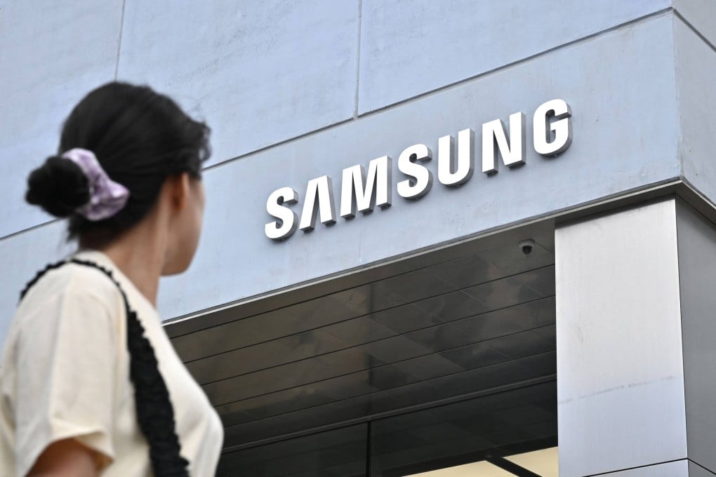 A woman walks past a new flagship store of Samsung Electronics in Seoul, South Korea, on June 28, 2023. Photo: AFP