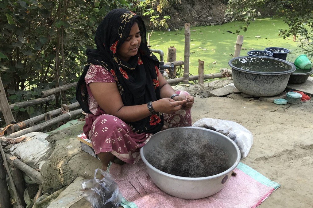 Hasina Bibi, 35, sorts cast-off human hair into strands. She earns less than US$100 per month for untangling about 25kg of hair. Photo: Sonia Sarkar