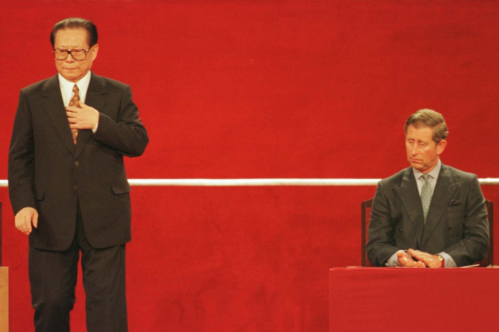 Chinese President Jiang Zemin (left) rises to speak at the Hong Kong Convention Center following the handover of Hong Kong to China on July 1, 1997, as Britain’s then-prince of Wales, Charles Windsor, applauds. Photo: AFP/pool