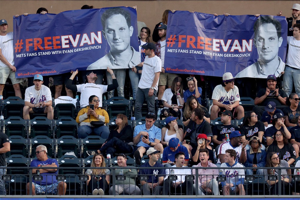 Friends of detained Wall Street Journal reporter Evan Gershkovich during a New York Mets and New York Yankees baseball game. Photo: TNS