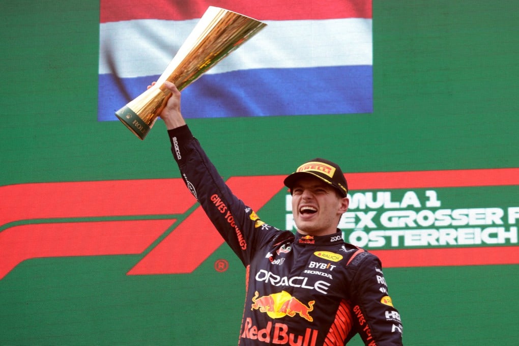 Red Bull’s Max Verstappen celebrates with a trophy on the podium after winning the Austrian Grand Prix. Photo: Reuters