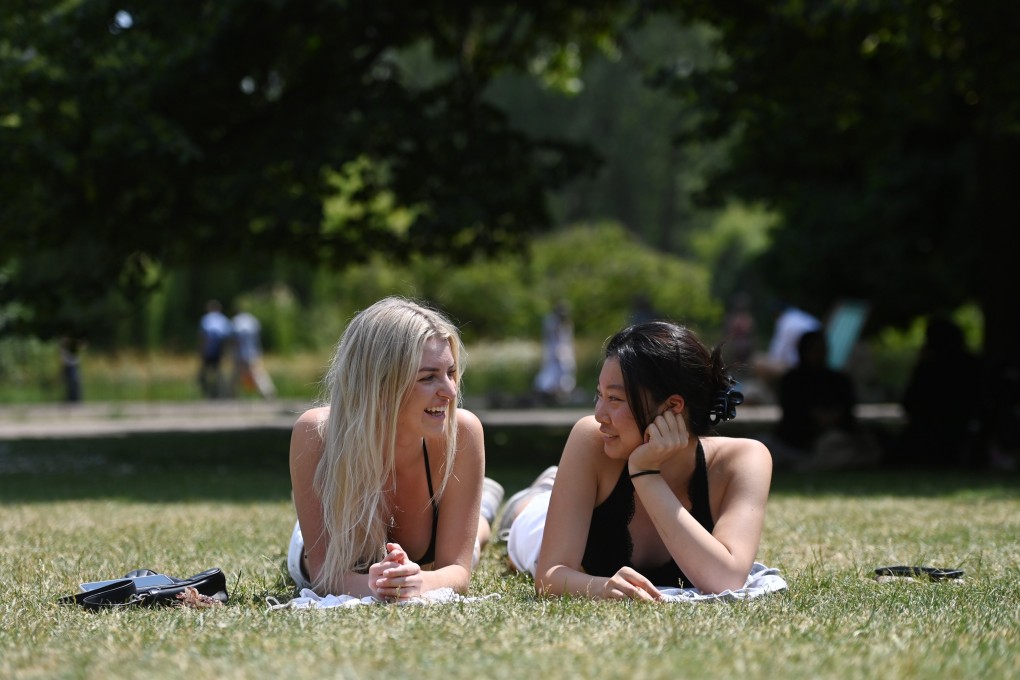 Women sunbathe in St James’ Park, London during a record-breaking heatwave in June. Photo: EPA-EFE