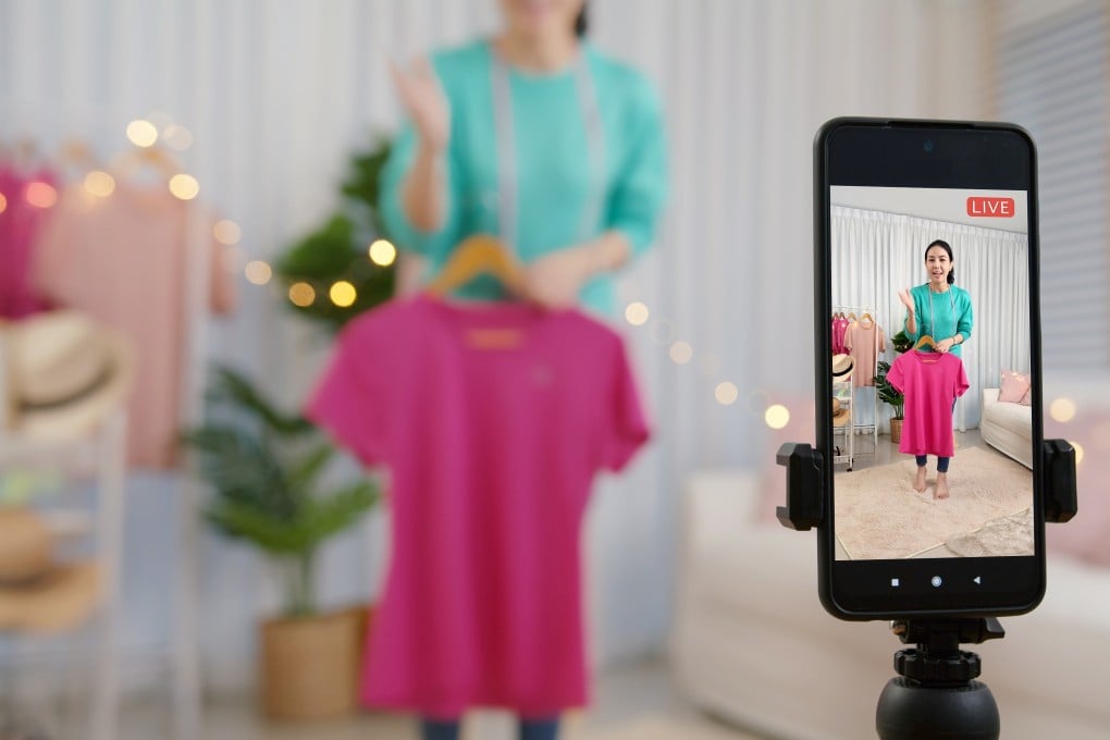 An online influencer sells products in a livestreaming video sale. Photo: Shutterstock
