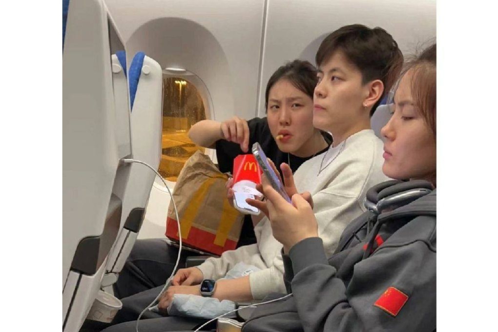 China’s basketball stars on a flight back home after winning the Asia Cup in Sydney. Photo: Weibo