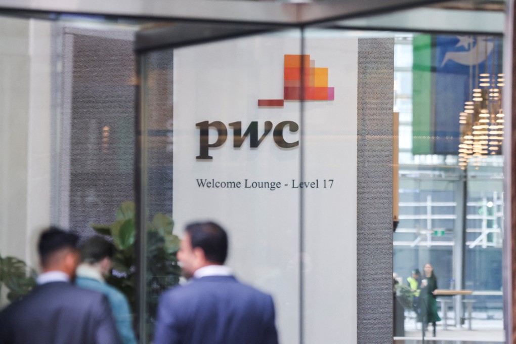 The PwC sign is seen in the lobby of the firm’s offices in Barangaroo, Australia, in June. Photo: Reuters