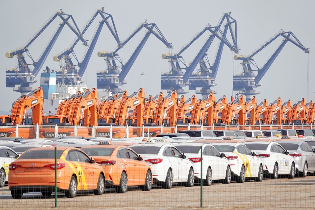 Cranes load and unload cargo ships at the port of Yantai, Shandong province. A Washington think tank is developing a new way to measure China’s economic output. Photo: Xinhua