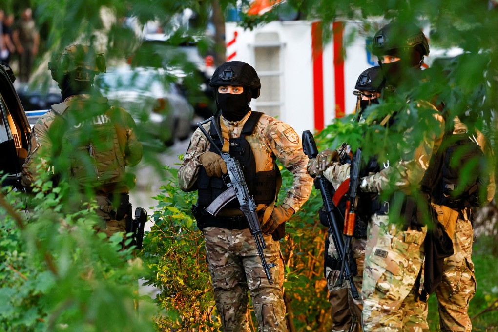 Police special operations team members are seen at the site of a Kyiv district court where an explosive device had been detonated on Wednesday. Photo: Reuters