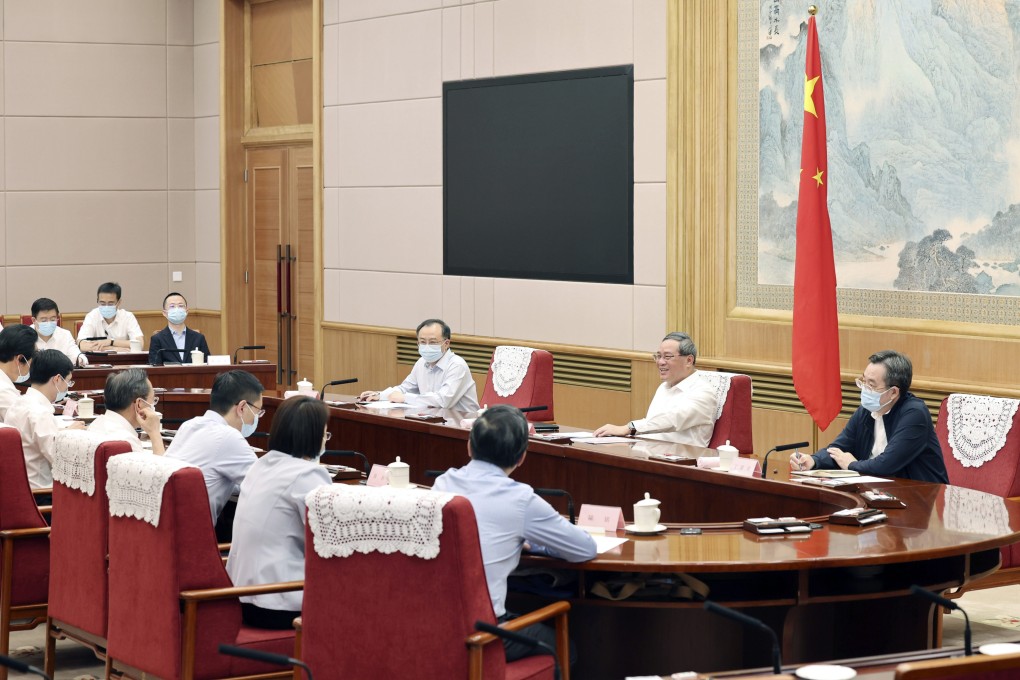 Chinese Premier Li Qiang (right) holds a symposium on the economic situation, listening to opinions and suggestions from experts and scholars on the country’s economy and work, in Beijing on Thursday. Photo: Xinhua