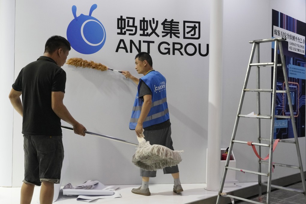 Workers set up a booth for Ant Group ahead of the upcoming World Artificial Intelligence Conference in Shanghai on July 5, 2023. Photo: AP