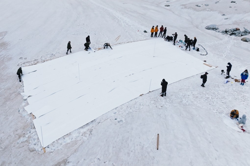 Researchers at Nanjing University cover the glacier with self-developed radiative cooling film to preserve the snow at Dagu Glacier on June 30, 2023. Photo: Handout