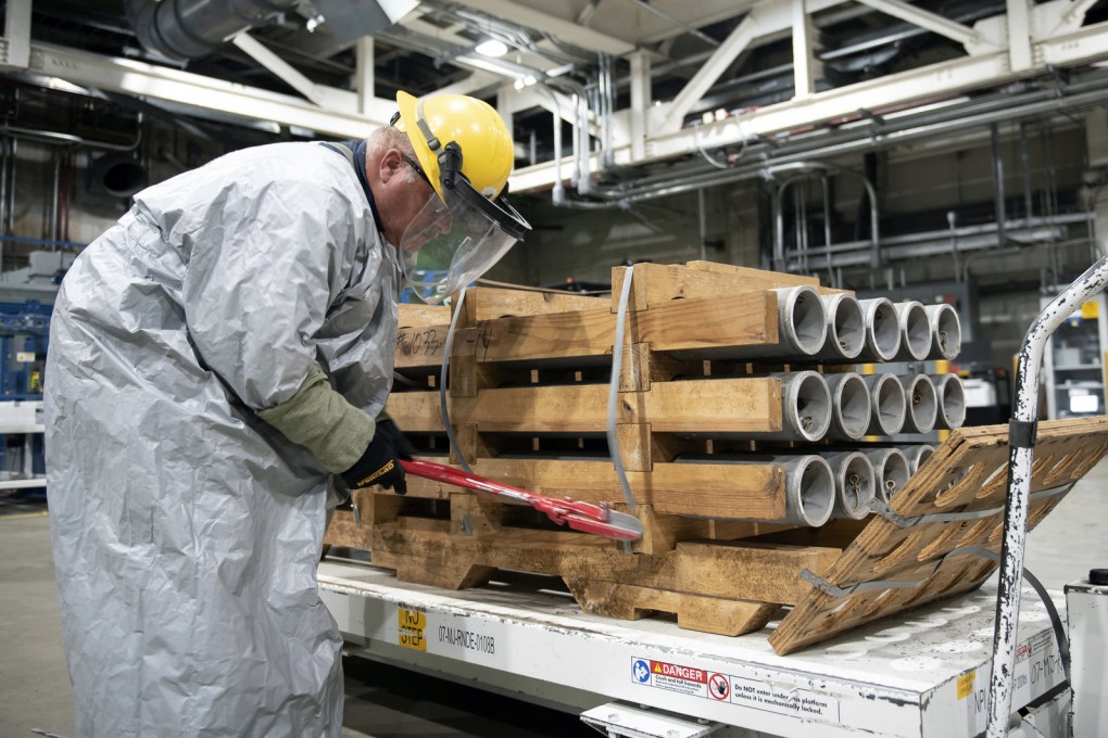 An operator cuts the metal bands on a pallet of M55 rockets containing the sarin nerve agent in July last year at the Blue Grass Army Depot near Richmond, Kentucky, US. Photo: US Army via AP
