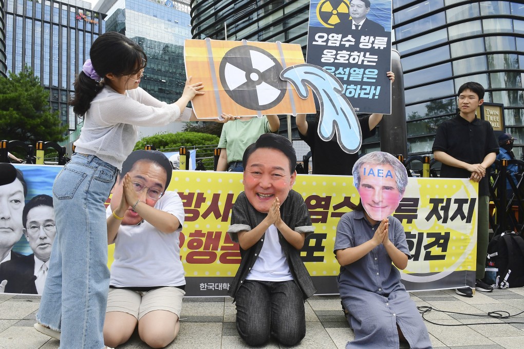 People gather near the Japanese Embassy in Seoul on Friday to protest against Japan’s plan to release treated radioactive water from the crippled Fukushima Daiichi nuclear power plant into the sea. Photo: Kyodo