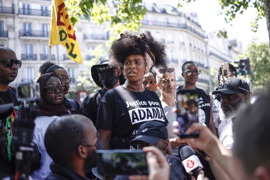 Assa Traore, centre, half-sister of Adama Traore delivers a speech during a protest against police brutality and racism in Paris, France on Saturday. Photo: EPA-EFE