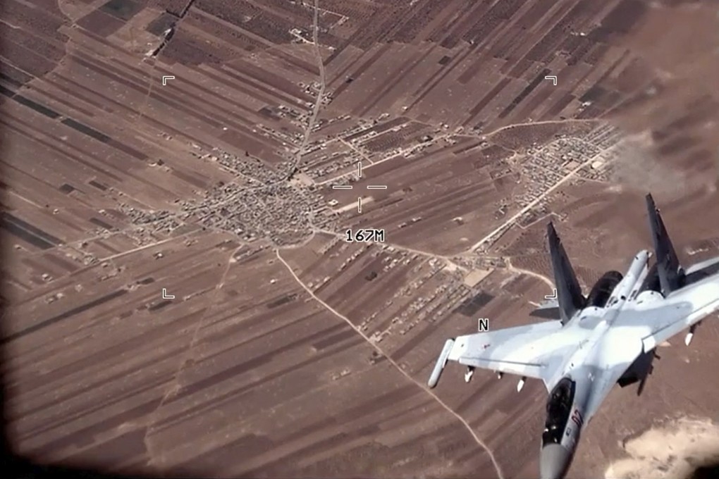 A Russian SU-35 flies near a US Air Force MQ-9 Reaper drone on Wednesday. Photo: US Air Force via AP