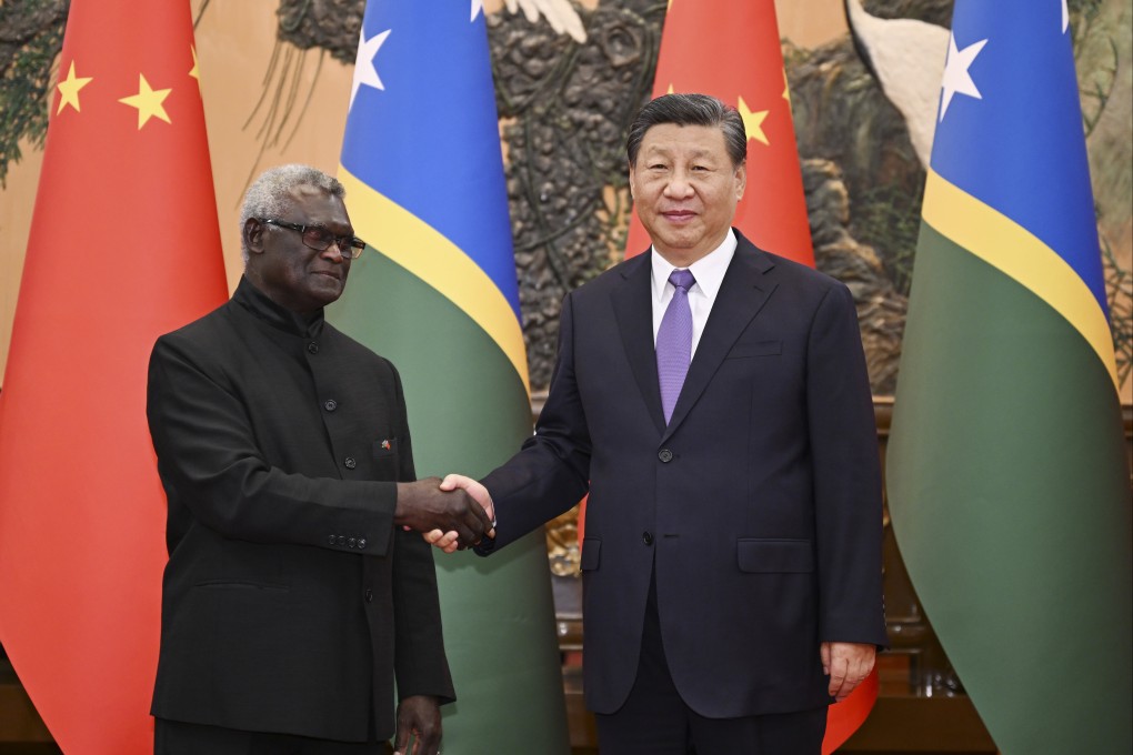 Chinese President Xi Jinping and Prime Minister  Manasseh Sogavare of the Solomon Islands at the Great Hall of the People in Beijing on Monday. Photo: Xinhua
