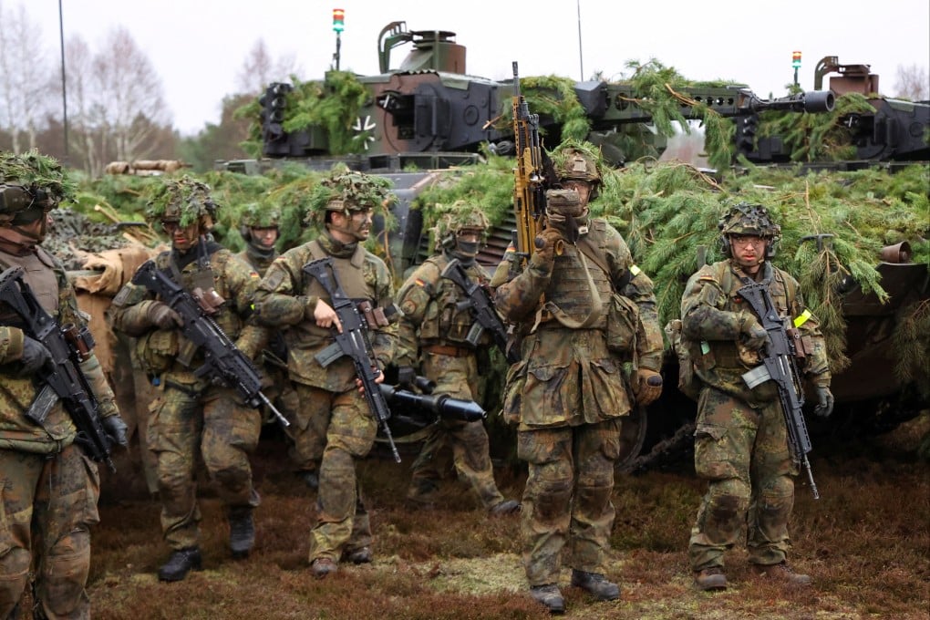 German soldiers stand near infantry fighting vehicles during a training exercise earlier this year. Up to 240 German soldiers, among them 170 paratroopers and 40 marines, will take part in this year’s Talisman Sabre exercise in Australia. Photo: Reuters