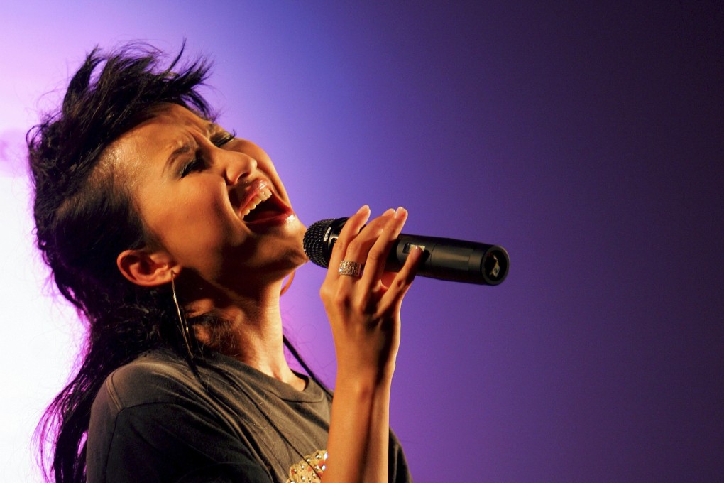 Hong Kong singer Coco Lee performs during a concert at the opening ceremony of a new hotel in Hong Kong on August 19, 2005. Lee’s death by suicide is the latest reminder that successful people and those in highly regarded professions are not immune to mental health struggles. Photo: AP