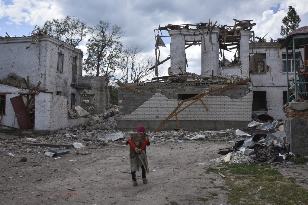 An elderly woman walks next to buildings destroyed in a Russian strike in the town of Orikhiv, Zaporizhzhia region, Ukraine on Monday. Photo: AP