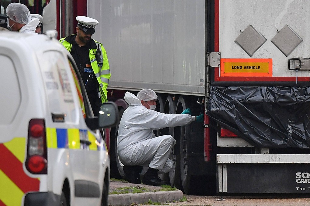 UK forensics officers work on a lorry, found to be containing the dead bodies of 39 Vietnamese migrants, at an industrial park near London in October 2019. Photo: AFP