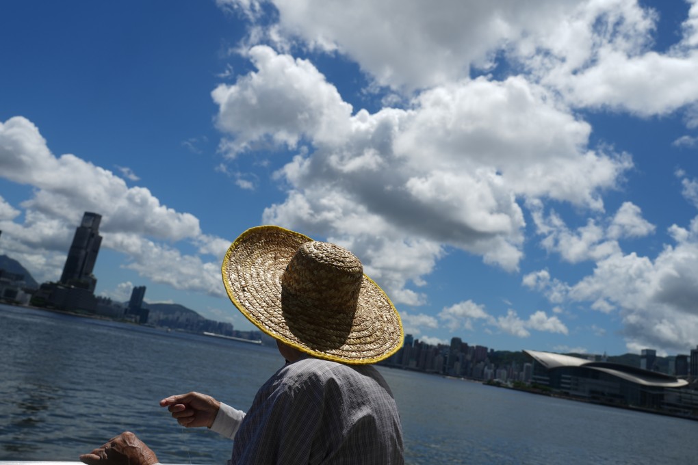 A man fishes at Central Pier in Hong Kong amid hot weather on July 10, 2023. Photo: Sam Tsang