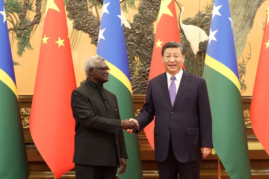 Chinese President Xi Jinping and Solomon Islands Prime Minister Manasseh Sogavare shake hands at the Great Hall of the People in Beijing. Photo: Reuters