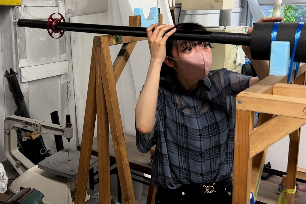 Yuna Kato works with her college club to produce a light human-powered aircraft at Tokyo University. Photo: Reuters