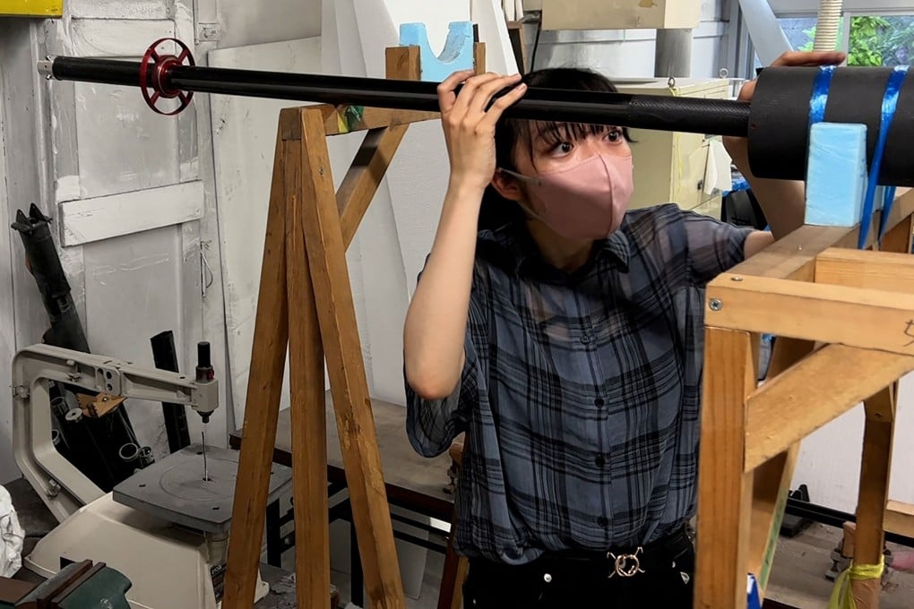 Yuna Kato works with her college club to produce a light human-powered aircraft at Tokyo University. Photo: Reuters