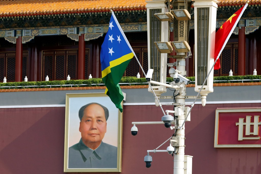 The national flags of Solomon Islands and China flutter near the Tiananmen Gate on Tuesday. Beijing has lavished attention on the Pacific nation since it severed ties with Taiwan in 2019. Photo: Reuters