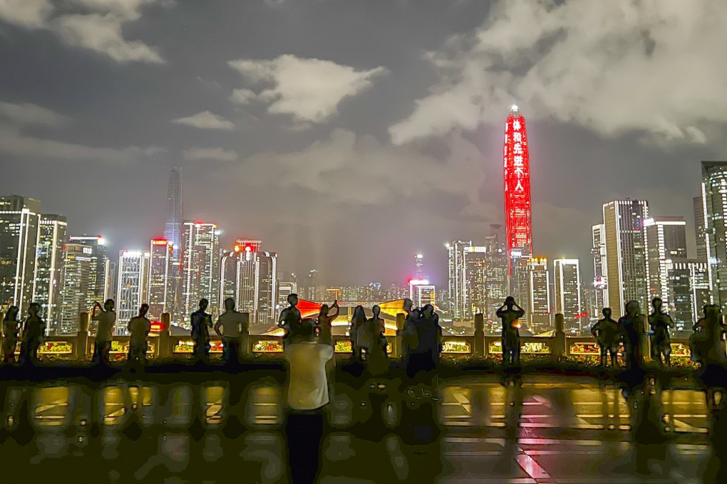People enjoy a night view of Shenzhen’s skyline from the top of Lianhuashan Park. Known as the Silicon Valley of China, the city in southern Guangdong province has experienced unprecedented growth over the past 40 years. Photo:  Erika Na