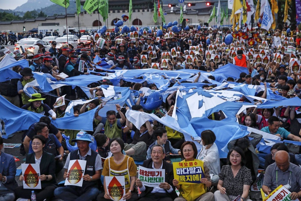 South Koreans protest against Japan’s plan to release treated waste water from the Fukushima nuclear plant site into the sea, in Seoul on July 8. Photo: Bloomberg